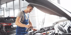 Open car mechanic repairing the car